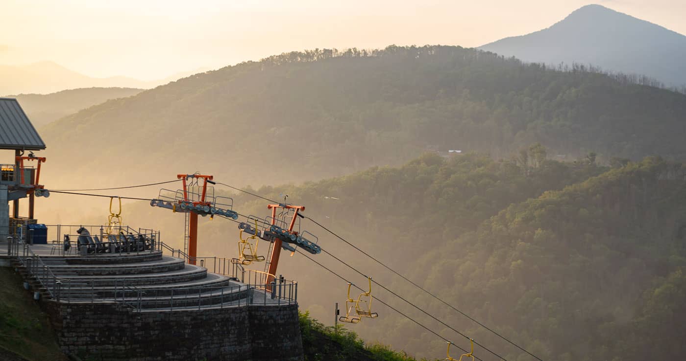 The SkyLift with a morning sunrise in the background.